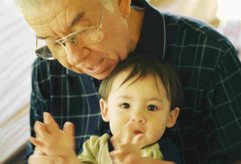 grandpa with cute tot on his lap