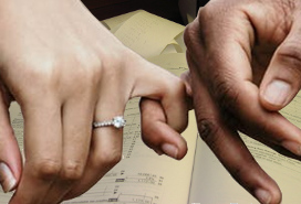 couple's hands linked by curled fingers, with tax documents as background